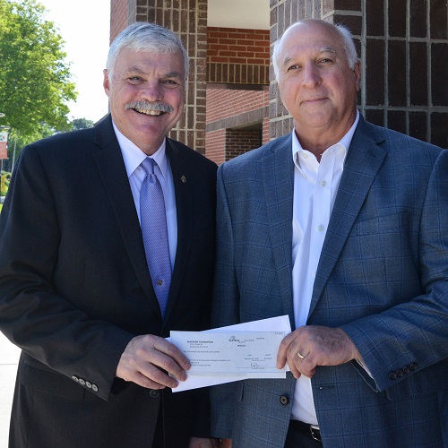 photo of Bill Ingram and Jeff Stoddard holding check
