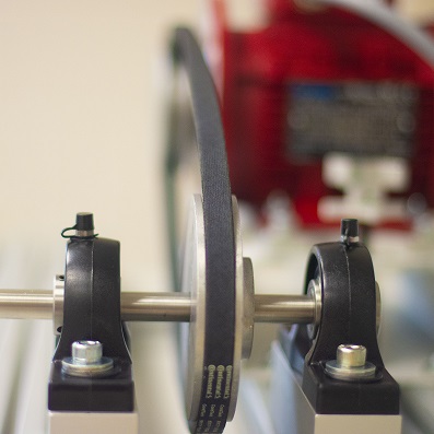 close up of manufaturing equipment pulley