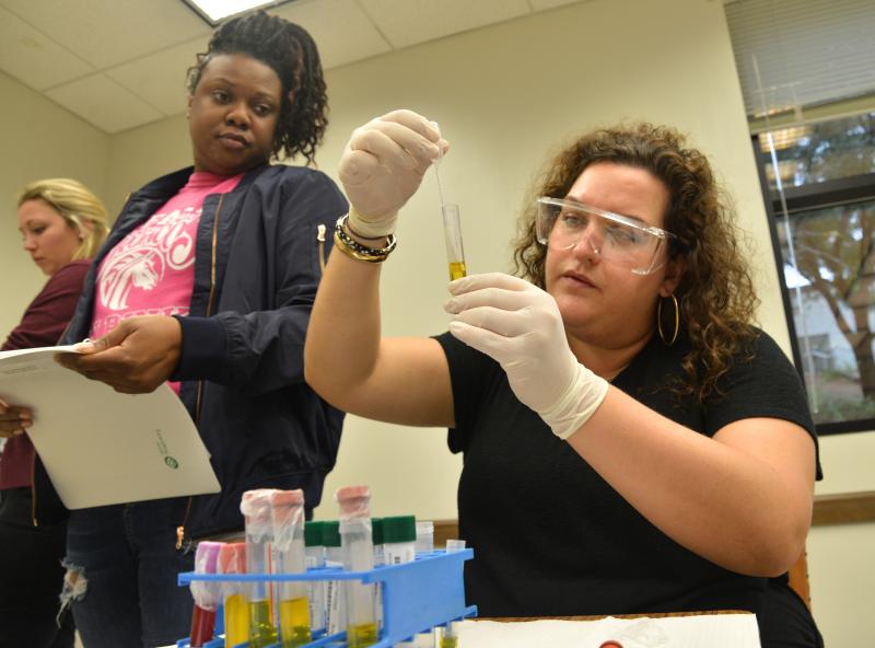 two female students study tube 