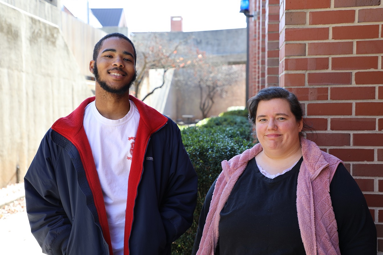 two students smiling at camera