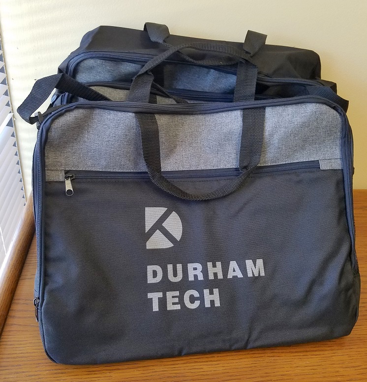 black and gray laptop bag with durham tech logo