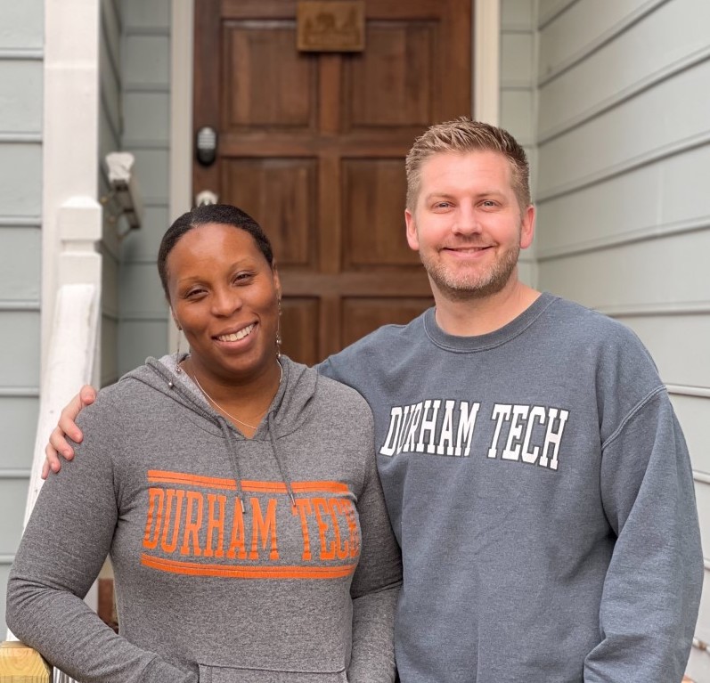 two people smiling at camera