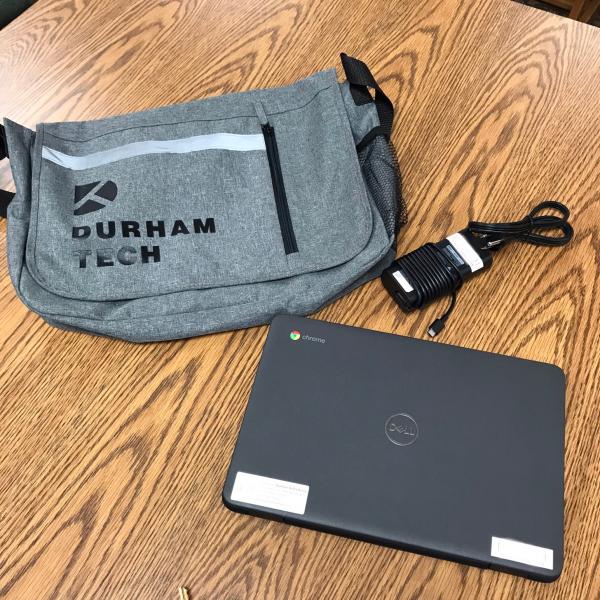 A Chromebook and Durham Tech bag.