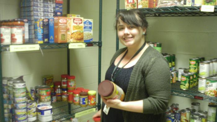 person standing in front of shelf of food