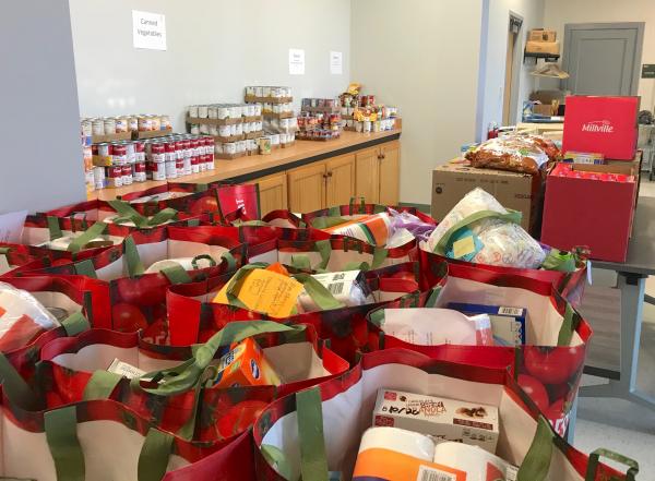 room full of bagged groceries and canned goods