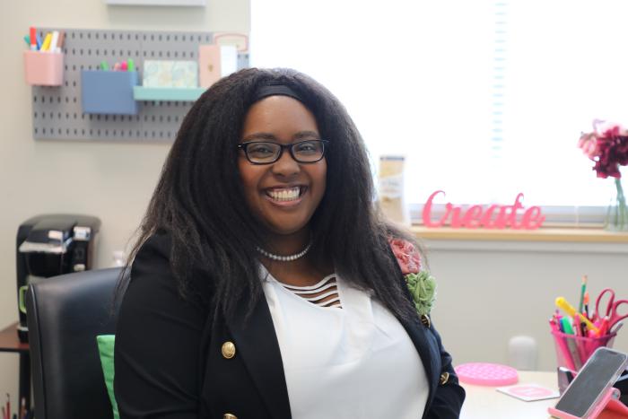 holly smiling at desk