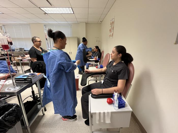 Students practice drawing blood in a phlebotomy class at Durham Tech.