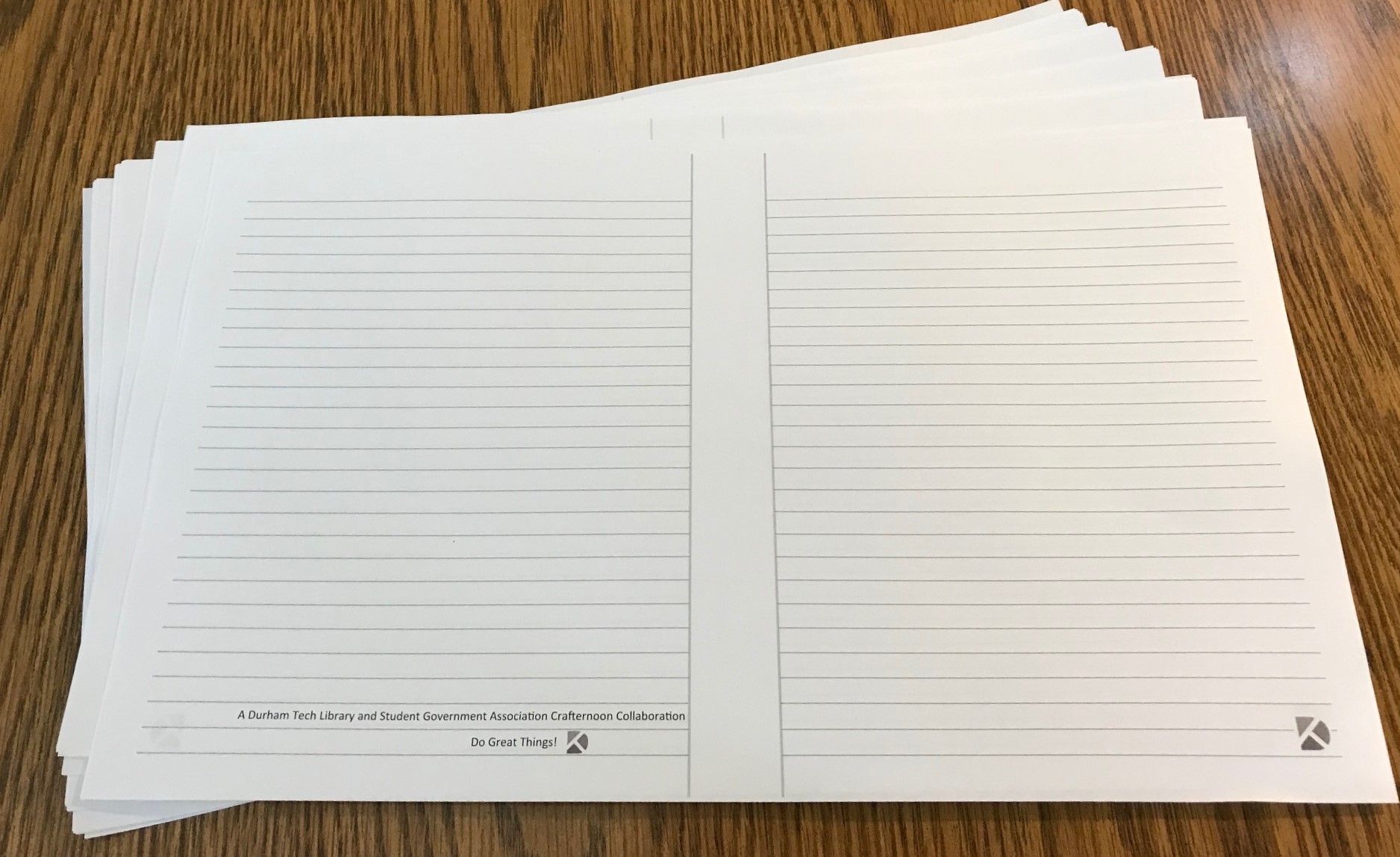 notebook pages printed and fanned out on table