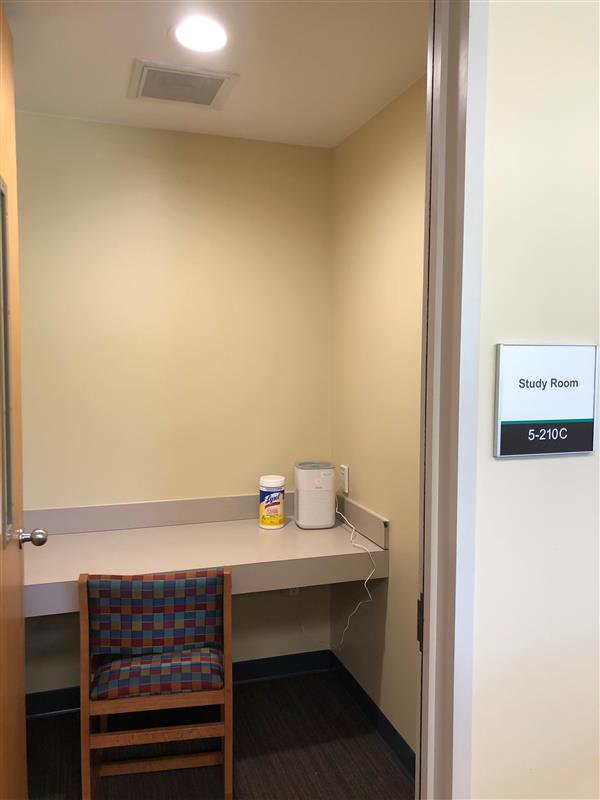private quiet study room with chair, air purifier, and chlorox wipes