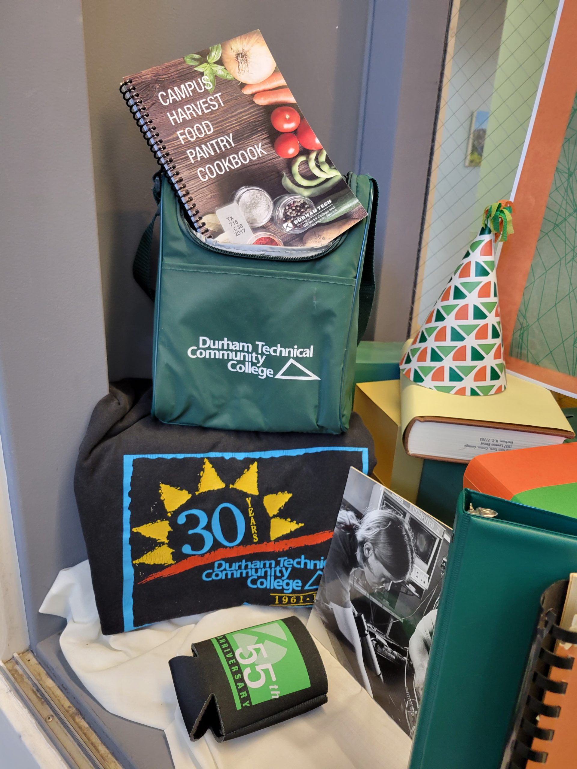 Durham Tech branded lunch bag, Food Pantry Cookbook, 30th anniversary t-shirt
