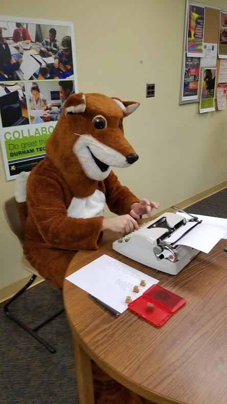 poetry fox at typewriter in main campus library