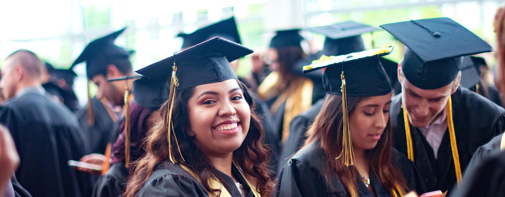 Students in cap and gown at graduation