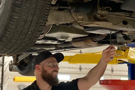 Tim Platz at work in Durham Tech's automotive bay.