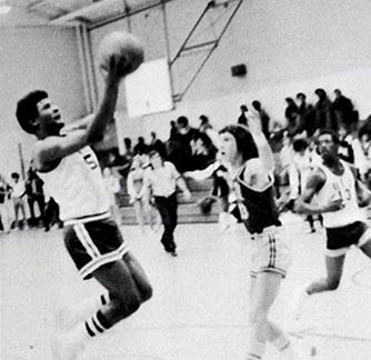 a basketball player takes a shot during a game