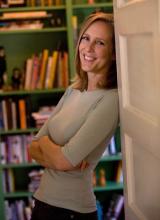 Author Mary Roach leans in a doorway