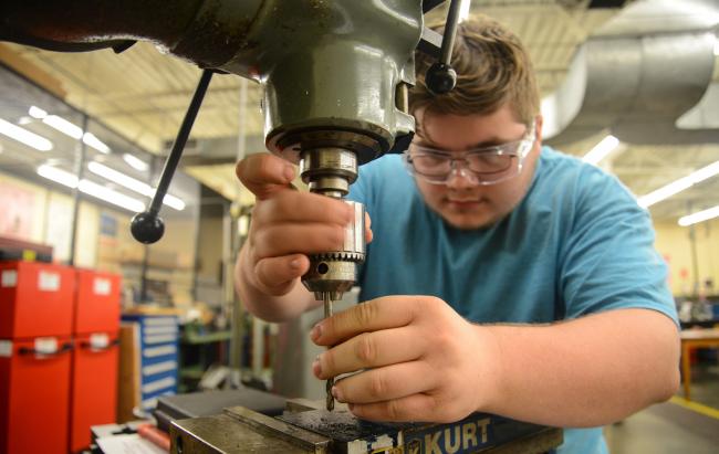 Man workin on drill press