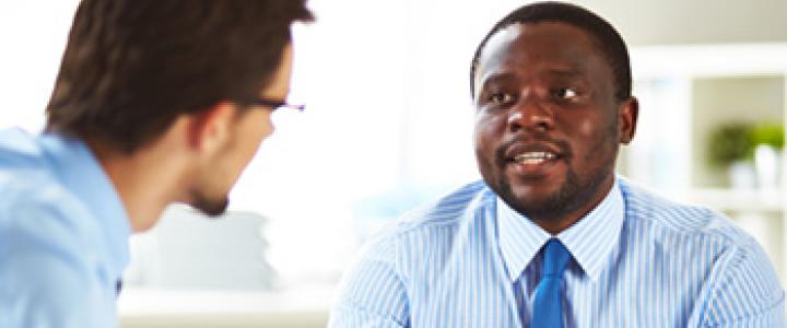 Men discussing business around a table