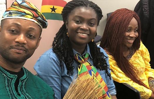 smiling EAP students, some dressed in traditional outfits