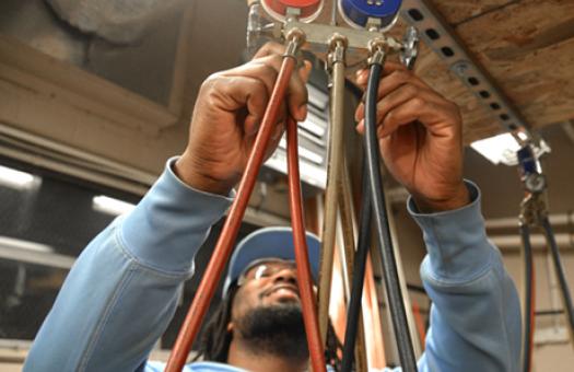male student working on system 