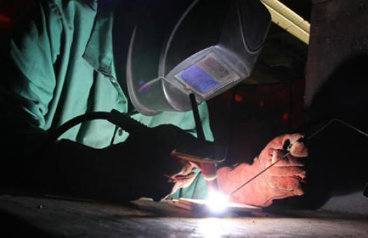 welding student works on project 