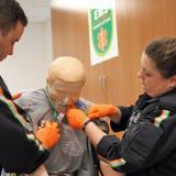 Two Emergency Medical Science students use a stethoscope on a training manikin during a class at the Durham Tech Orange County Campus.
