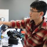 student working on equipment in electronics engineering lab
