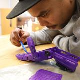 engineering student views connection on artificial hand