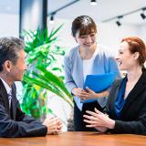 an interpreter translates during a business meeting