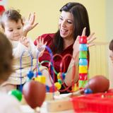 teacher plays games with toddlers
