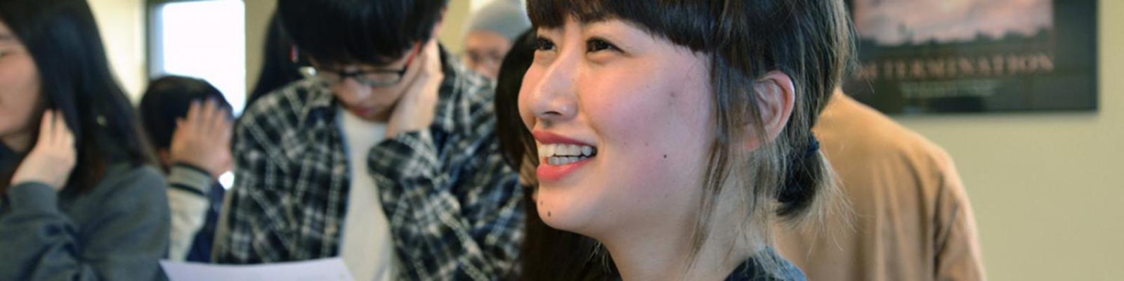 laughing international student in class