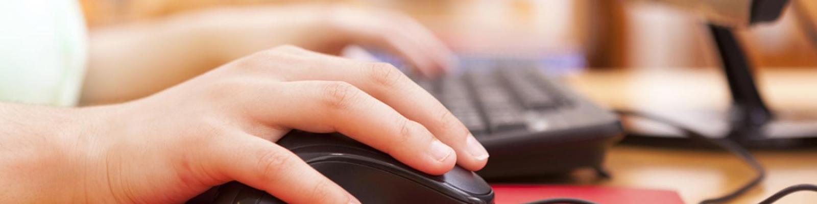 hands on a computer keyboard