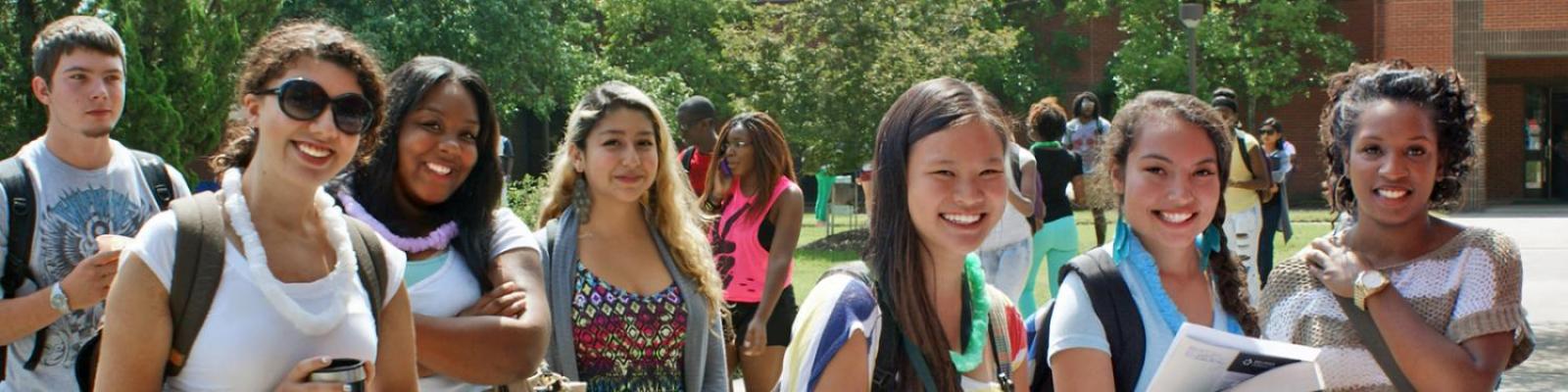 diverse group of Durham Tech students smiling at camera