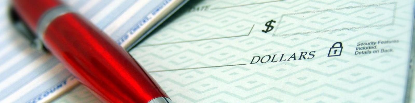 a pen and a bank check