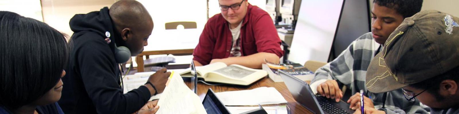 group of students studying in the library